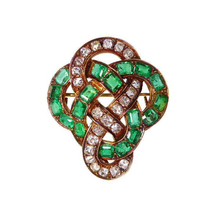 Emerald and diamond openwork scroll knot brooch